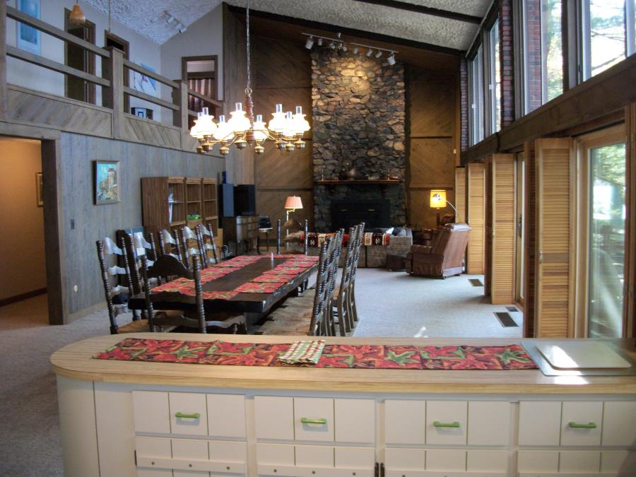 Great room extends from kitchen to magnificent fieldstone fireplace -- lot of room for everyone